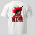 Vista posterior de camiseta blanca con ilustración gráfica roja del futbolista Luis Díaz con el número 14, y logo de Trnd.Ink en la parte frontal de la prenda