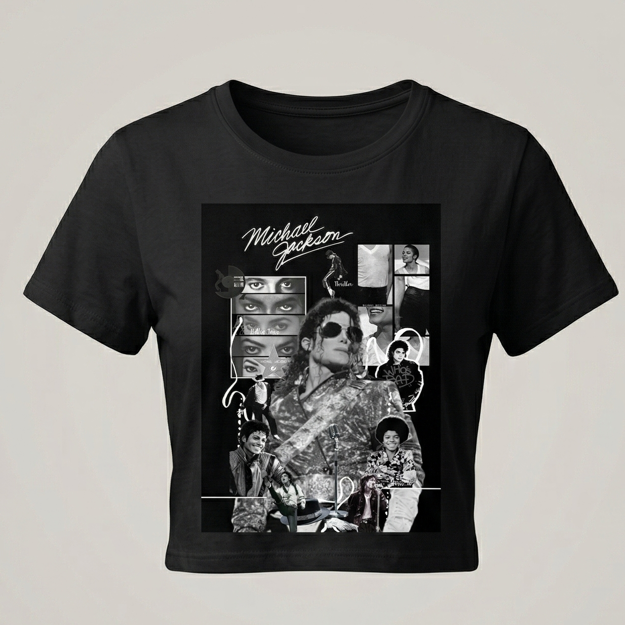 Vista frontal de un crop top negro para mujer con un diseño de collage artístico de Michael Jackson en blanco y negro, estilo camiseta de banda vintage de la marca trnd.ink.